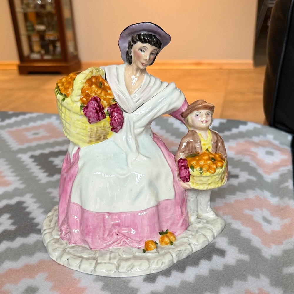 Vintage England hand painted ceramic figurine “fruit seller” pink white